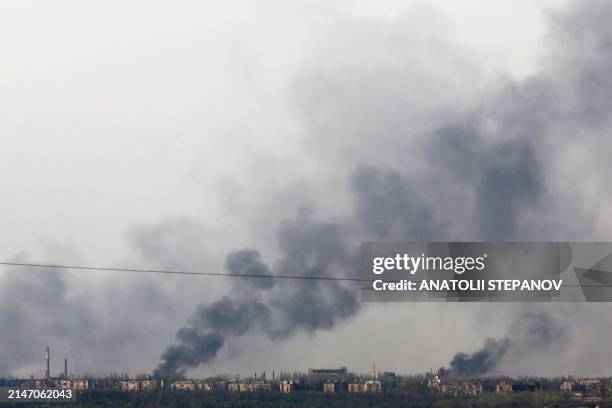 This photograph taken on April 11 near the town of Chasiv Yar, in Donetsk region, shows smoke rising from fires after bombing.