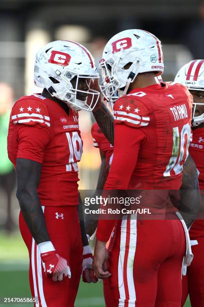 Ty Scott of the DC Defenders celebrates with Jordan Ta'amu after catching a pass for a touchdown during the fourth quarter against the Houston...
