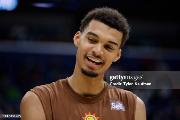 Victor Wembanyama of the San Antonio Spurs participates in warmups prior to a game against the New Orleans Pelicans at Smoothie King Center on April...