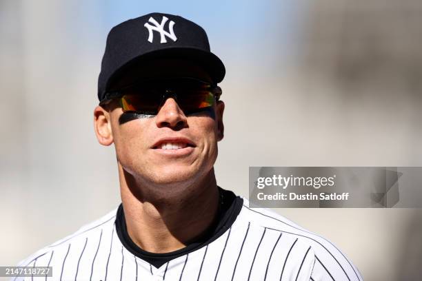 Aaron Judge of the New York Yankees jogs off the field at the end of the top of the fifth inning of the game against the Toronto Blue Jays at Yankee...