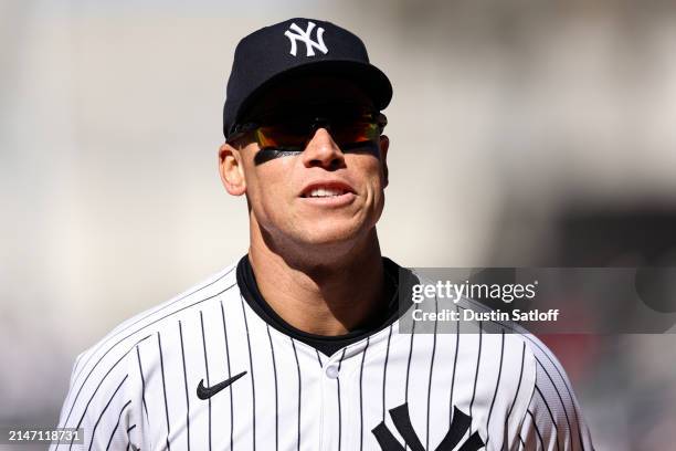 Aaron Judge of the New York Yankees jogs off the field at the end of the top of the fifth inning of the game against the Toronto Blue Jays at Yankee...