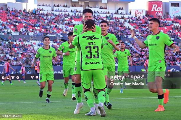 Manuel Castro of Juarez celebrates with Aitor Garcia after scoring the team's first goal during the 14th round match between Atletico San Luis and FC...