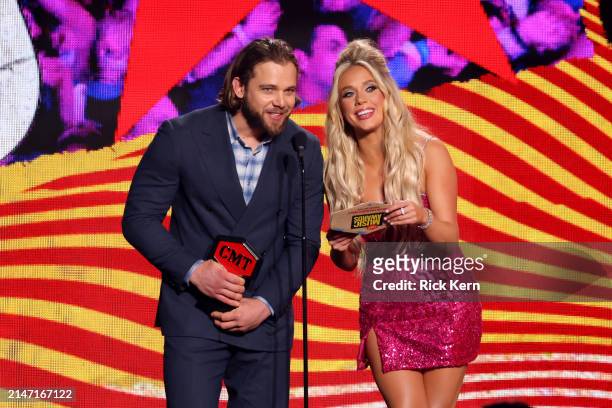 Max Thieriot and Megan Moroney speak onstage during the 2024 CMT Music Awards at Moody Center on April 07, 2024 in Austin, Texas.