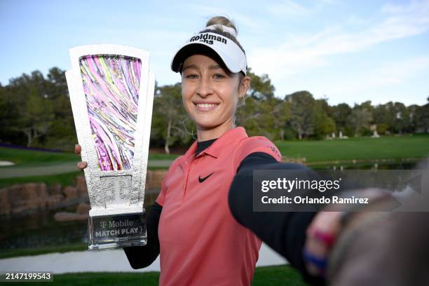 Nelly Korda of the United States imitates a “selfie” as she poses with the trophy on day five of the T-Mobile Match Play presented by MGM Rewards at...