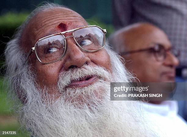 Vishwa Hindu Parishad Senior Vice-President Acharya Giriraj Kishore addresses a press conference as VHP spokesman Vireshwar Dwivedi looks on, in New...