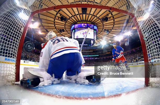Vincent Trocheck of the New York Rangers watches a shot by Chris Kreider get past Cayden Primeau of the Montreal Canadiens at 3:59 of the third...