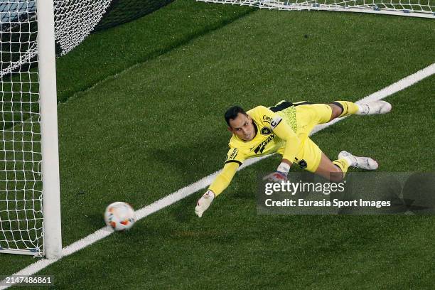 Goalkeeper Gatito Fernández of Botafogo dives to make a save during the Copa CONMEBOL Libertadores match between Botafogo and Junior at Estadio...