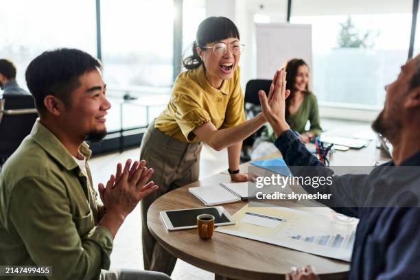 give me high-five colleague! - high five stockfoto's en -beelden