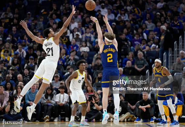 Brandin Podziemski of the Golden State Warriors shoots over Darius Bazley of the Utah Jazz during second half of an NBA basketball game at Chase...
