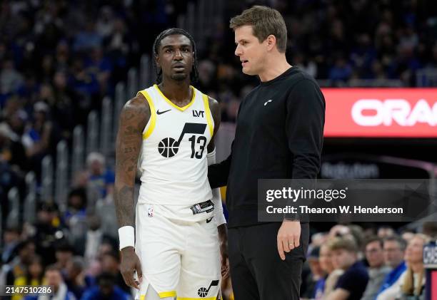 Head coach Will Hardy of the Utah Jazz talk with his player Kira Lewis Jr. #13 against the Golden State Warriors during the second half of an NBA...