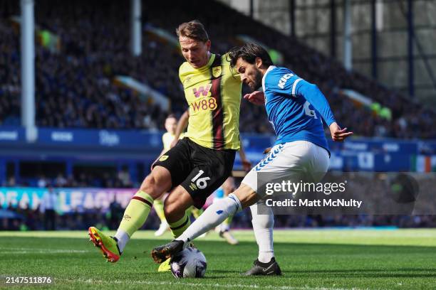 Andre Gomes of Everton is closed down by Sander Berge of Burnley during the Premier League match between Everton FC and Burnley FC at Goodison Park...