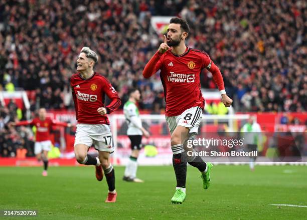Bruno Fernandes of Manchester United celebrates scoring his team's first goal during the Premier League match between Manchester United and Liverpool...