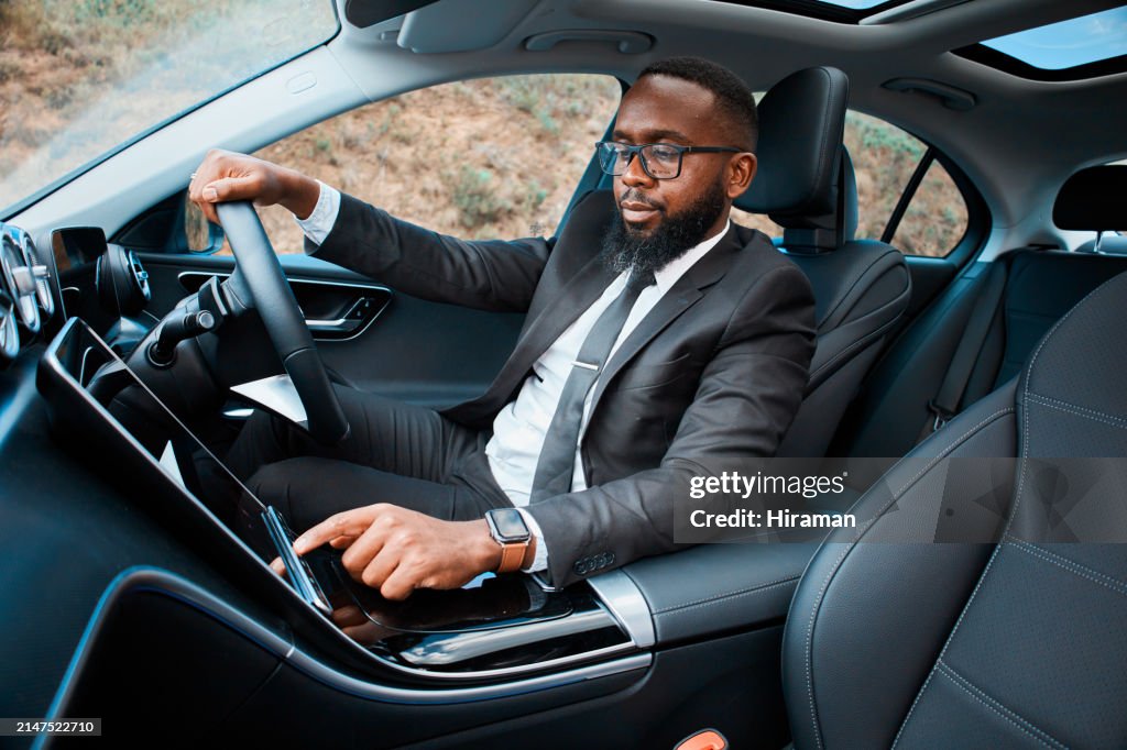 Confident Businessman Driving a Luxury Car on His Commute