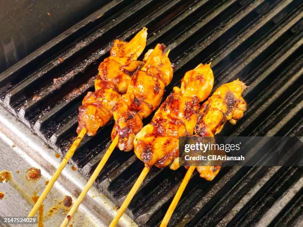 grilling chicken satay - satay stock pictures, royalty-free photos & images
