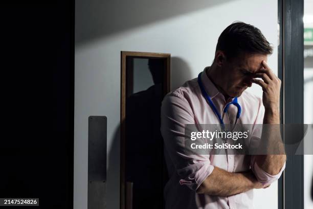 stressful days as a doctor - hospital doorway stock pictures, royalty-free photos & images