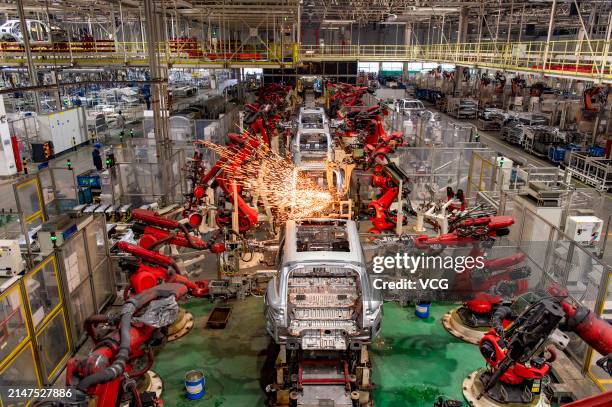 Robotic arms work at an intelligent factory of electric vehicle enterprise Leapmotor on April 8, 2024 in Jinhua, Zhejiang Province of China.