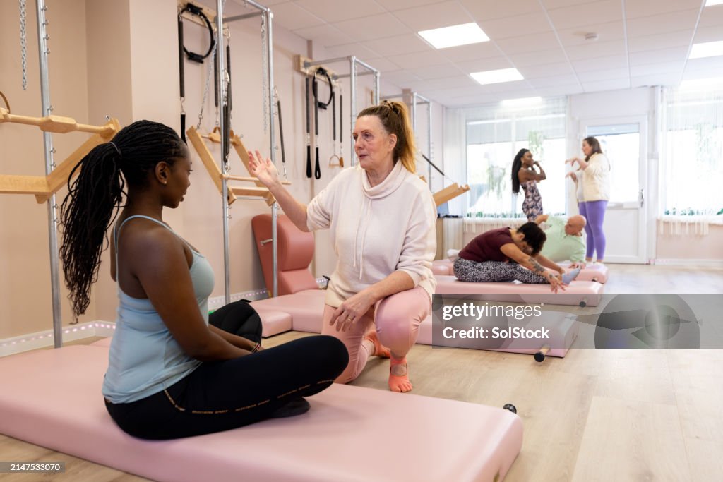 Instructing Class Professional Pilates Instructor With Private Class High-Res Stock Photo ...