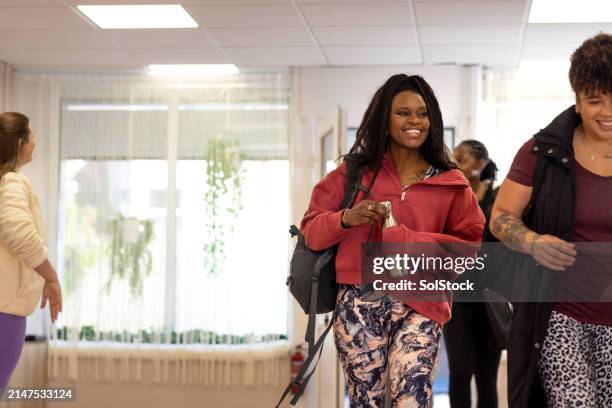 excited for pilates with friends - group of people walking stock pictures, royalty-free photos & images