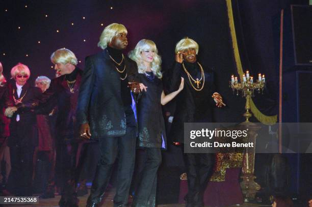 English professional footballer Ian Wright on the catwalk during a William Hunt fashion show held at the Criterion Theatre, London, November 1998.