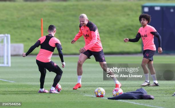 Phil Foden and Erling Haaland of Manchester City during a training session at Manchester City Football Academy on April 08, 2024 in Manchester,...