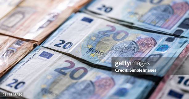 euro currency. banknotes stacked on each other in different positions.several hundred euro banknotes stacked by value - euro stock-fotos und bilder