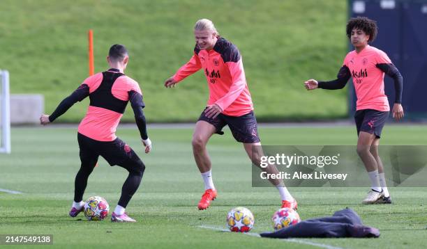 Phil Foden and Erling Haaland of Manchester City during a training session at Manchester City Football Academy on April 08, 2024 in Manchester,...