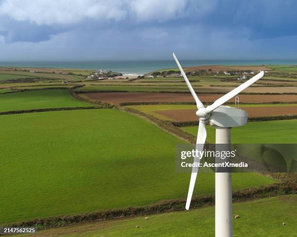 aerial view of wind turbine and agricultural fields - agricultural field stock pictures, royalty-free photos & images
