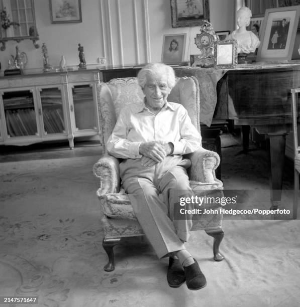 German born British businessman and philanthropist Sir Robert Mayer seated in an armchair in a living room in England, circa 1980. Robert Mayer...
