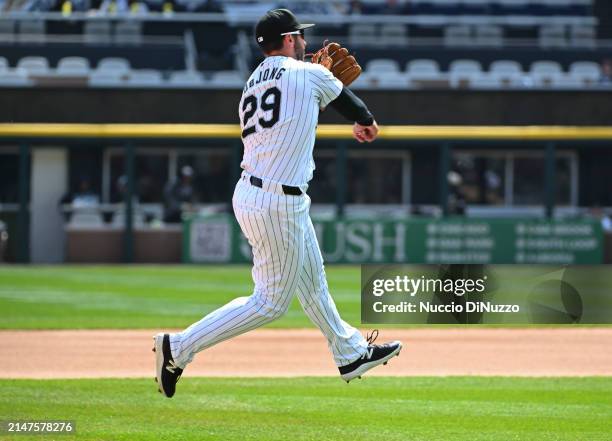 Paul DeJong of the Chicago White Sox throws to first against the Detroit Tigers at Guaranteed Rate Field on March 31, 2024 in Chicago, Illinois.