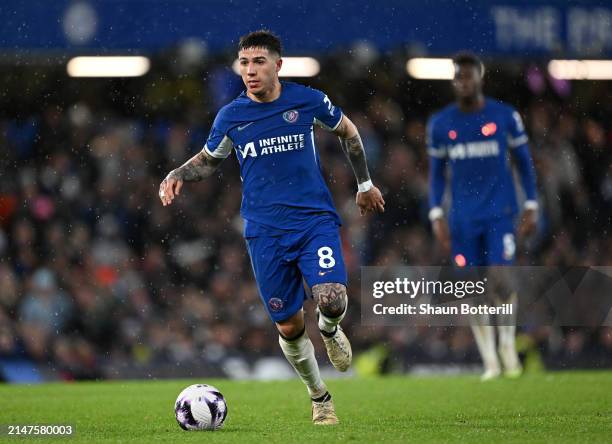 Enzo Fernandez of Chelsea runs with the ball during the Premier League match between Chelsea FC and Manchester United at Stamford Bridge on April 04,...