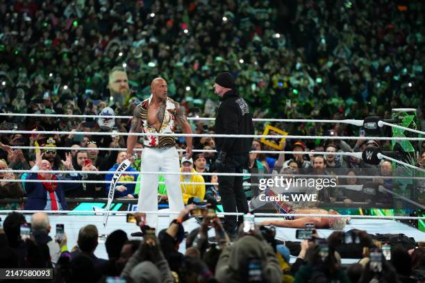 The Rock and The Undertaker fight on Night Two of WrestleMania 40 at Lincoln Financial Field on April 7, 2024 in Philadelphia, Pennsylvania.