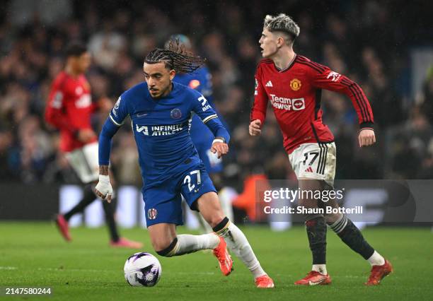 Malo Gusto of Chelsea breaks away from Alejandro Garnacho of Manchester United during the Premier League match between Chelsea FC and Manchester...