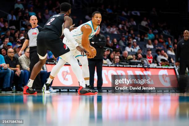Grant Williams of the Charlotte Hornets controls the ball during the first half of a basketball game against the Portland Trail Blazers at Spectrum...