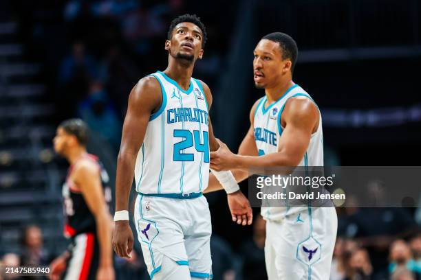 Brandon Miller of the Charlotte Hornets looks to the video board during the second half of a basketball game against the Portland Trail Blazers at...