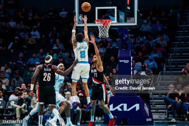 Nick Smith Jr. #8 of the Charlotte Hornets shoots the ball over Rayan Rupert of the Portland Trail Blazers during the second half of a basketball...