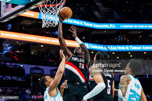 Duop Reath of the Portland Trail Blazers lays the ball up during the second half of a basketball game against the Charlotte Hornets at Spectrum...