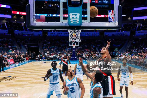 Kris Murray of the Portland Trail Blazers lays the ball up during the second half of a basketball game against the Charlotte Hornets at Spectrum...