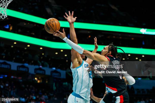 Dalano Banton of the Portland Trail Blazers lays the ball up during the second half of a basketball game against the Charlotte Hornets at Spectrum...