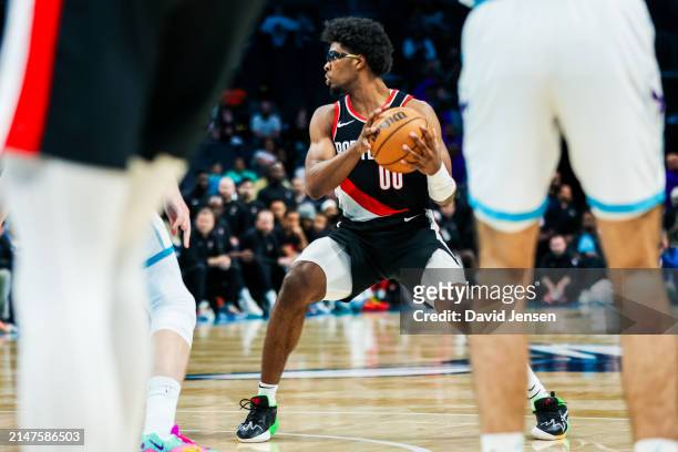 Scoot Henderson of the Portland Trail Blazers controls the ball during the second half of a basketball game against the Charlotte Hornets at Spectrum...