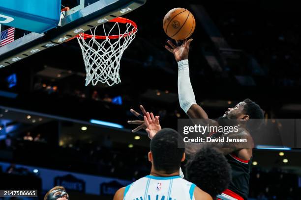 Deandre Ayton of the Portland Trail Blazers lays the ball up during the second half of a basketball game against the Charlotte Hornets at Spectrum...