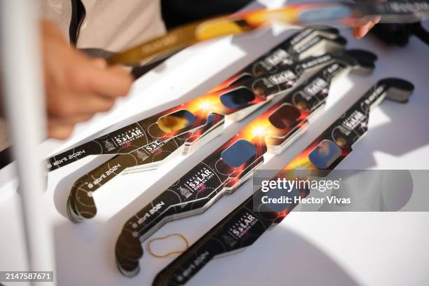 Glasses to see the eclipse are distributed to people on April 08, 2024 in Mazatlan, Mexico. Millions of people have flocked to areas across North...