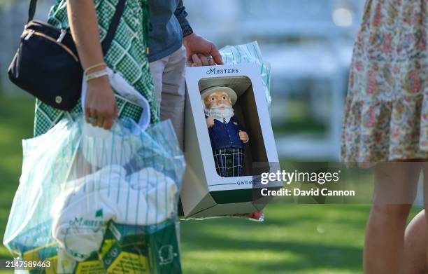 Detailed photograph of a patron's shopping including the popular Gnome during a practice round prior to the 2024 Masters Tournament at Augusta...