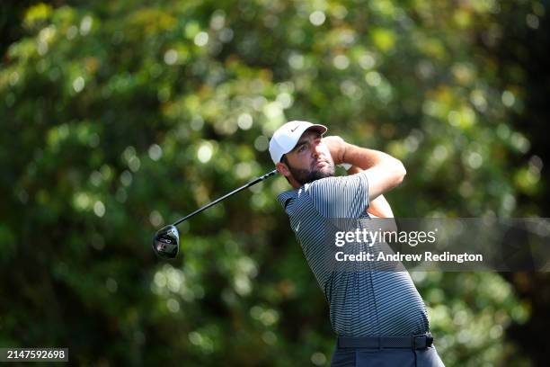 Scottie Scheffler of the United States hits his shot from the 11th tee during a practice round prior to the 2024 Masters Tournament at Augusta...