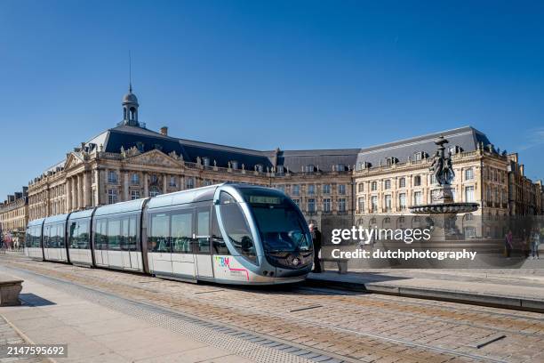 afternoon tram commute, bourse, bordeaux - vervoermiddel stock pictures, royalty-free photos & images