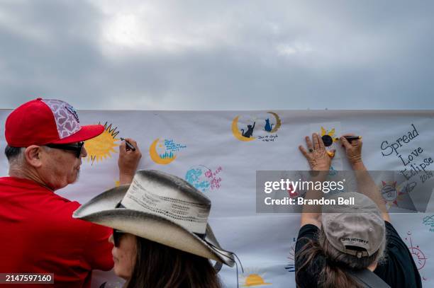 People participate in activities at Louise Hays Park while waiting to view the total eclipse on April 08, 2024 in Kerrville, Texas. Millions of...