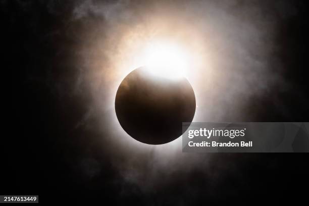 The moon begins its descent below the sun's horizon during a total solar eclipse on April 08, 2024 in Brady, Texas. Millions of people have flocked...