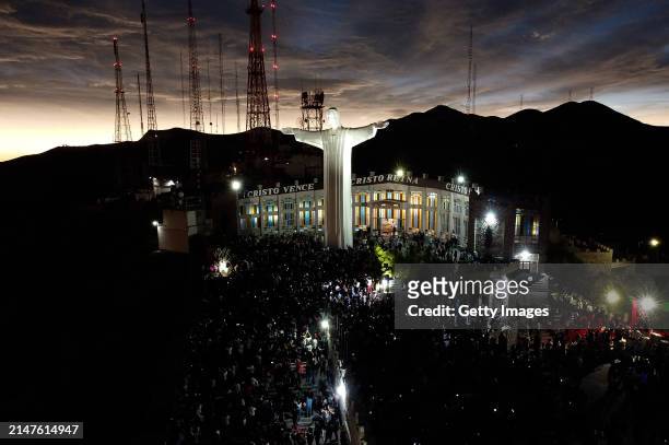 Aerial view of people watching the total eclipse at Cristo de las Noas on April 08, 2024 in Torreon, Mexico. Millions of people have flocked to areas...