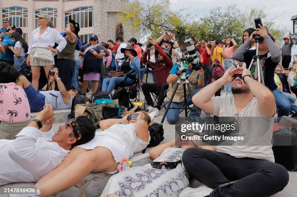 People watch the total eclipse at Cristo de Las Noas on April 08, 2024 in Torreon, Mexico. Millions of people have flocked to areas across North...