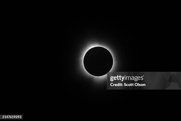 The moon eclipses the sun viewed from the campus of Southern Illinois University on April 08, 2024 in Carbondale, Illinois. People have travelled...