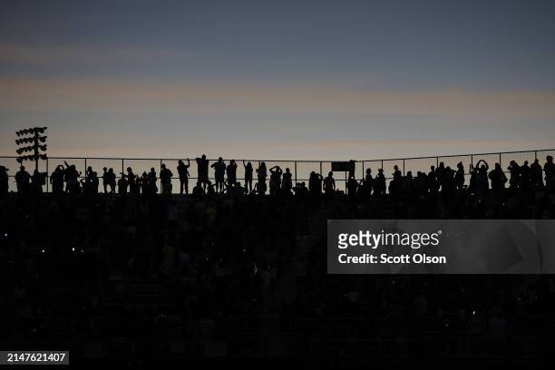 People view the total eclipse from Saluki Stadium on the campus of Southern Illinois University on April 08, 2024 in Carbondale, Illinois. Millions...